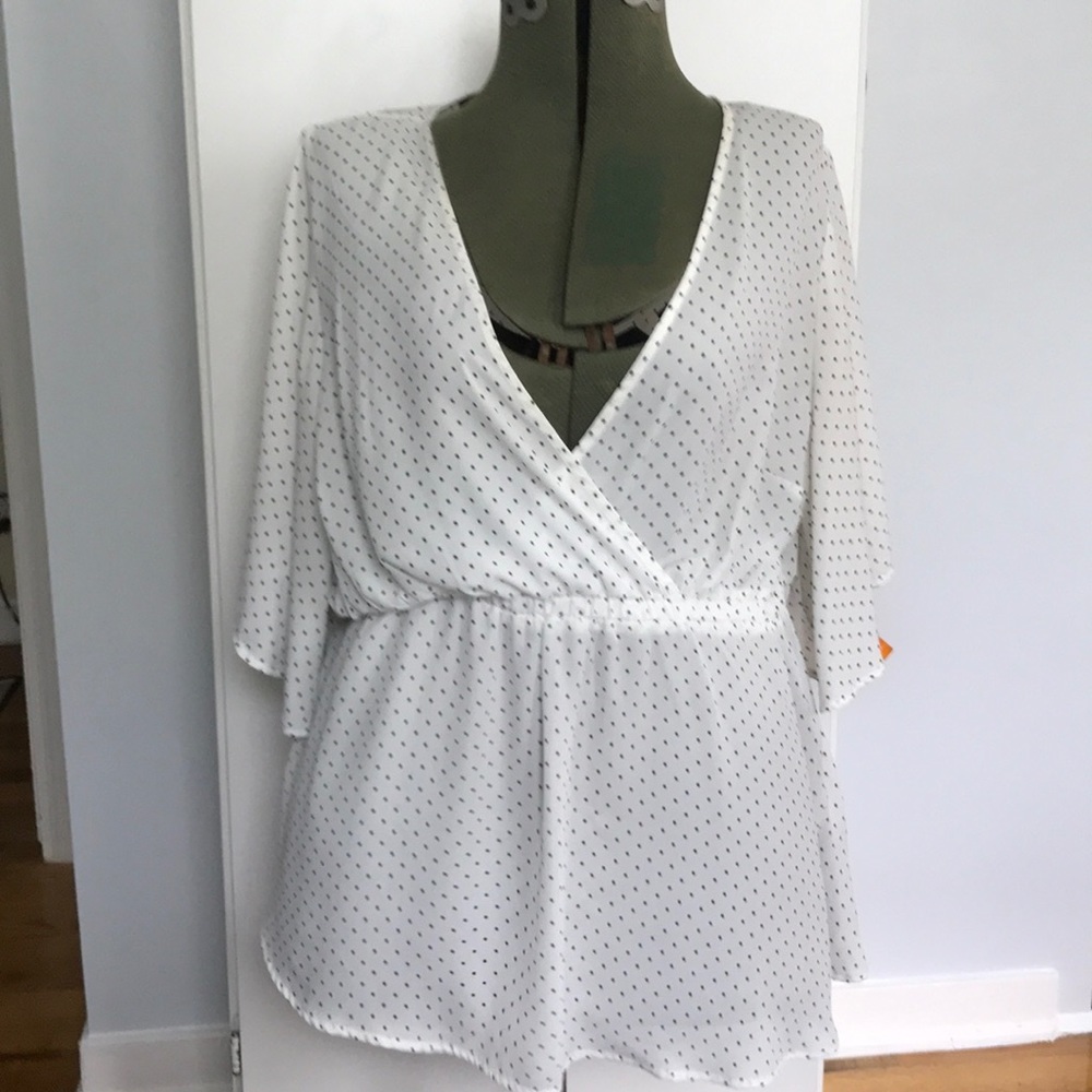 Torrid white with polk-a-dot empire waist blouse